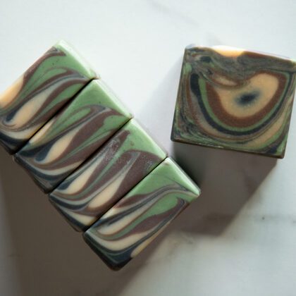 Green, purple, white, and blue soap